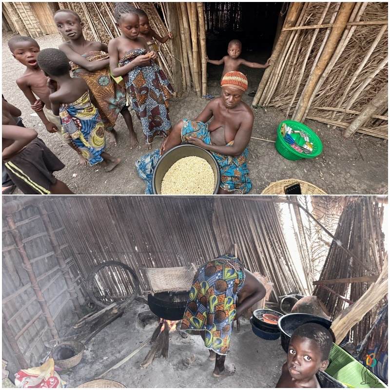 mujer holi cocinando en una olla dentro de la choza